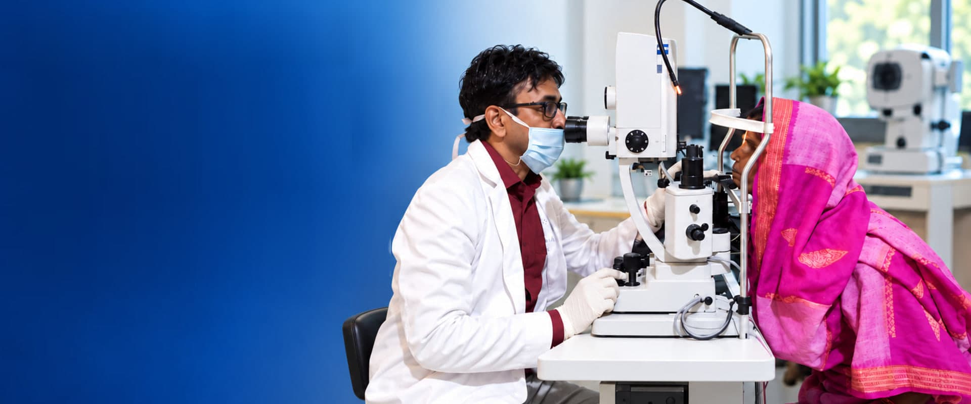 An eye doctor examines a patient at a slit lamp at Ruby Eye Hospital, Berhampur